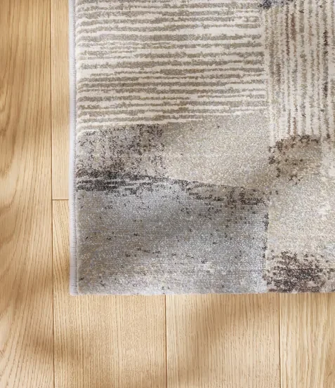 Tepih GENT VAPOR moderni apstraktni tepih u bež, krem, ivory, svijetlosivim i tamnosivim tonovima, izrađen od 100% PP Heatset materijala s teksturiranom površinom.